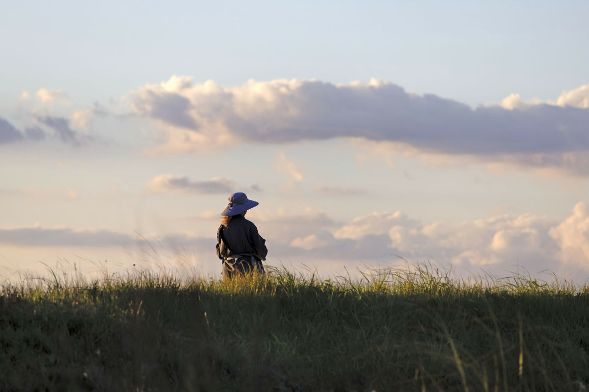 Pensive Woman on an Open Field