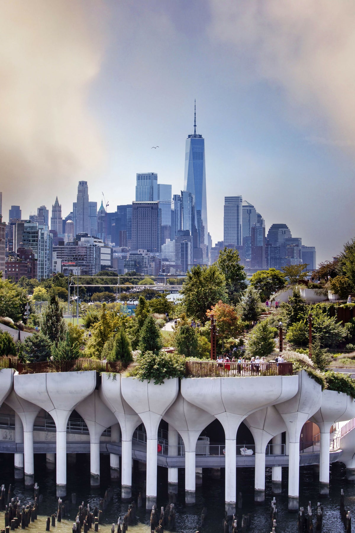 New York City, Manhattan, Little Island with Pilings at Pier 55 and Freedom Tower in the Background