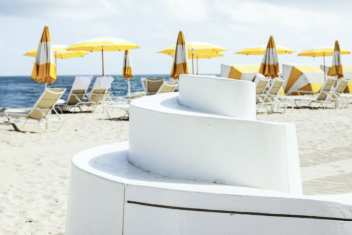 Florida, Fort Lauderdale, Beach with Yellow Umbrellas and Part of the Wave Wall on Ocean Drive