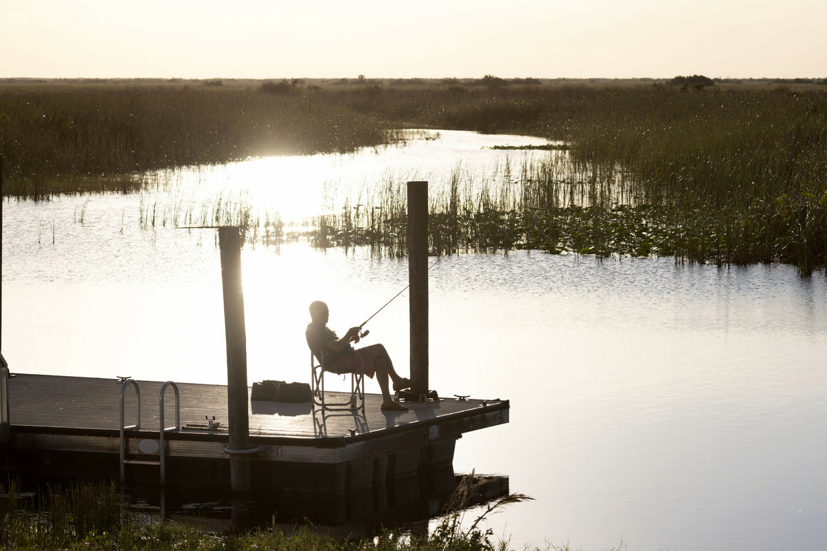 Tranquil Woman Fishing on Diving Platform