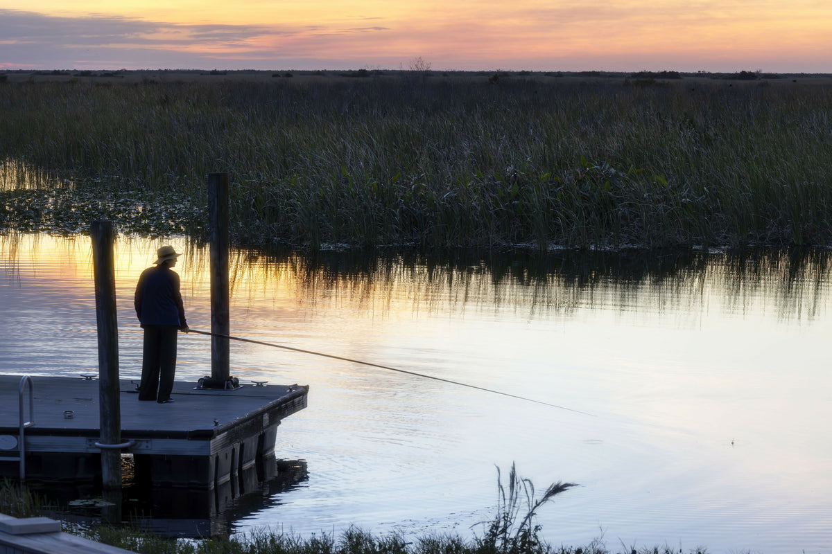 Woman Fishing on Diving Platform