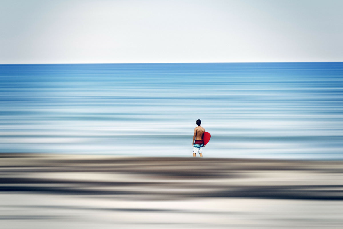 Serene Abstract of Surfer on the Beach